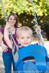 Child in swing, portrait from Photos by Orion