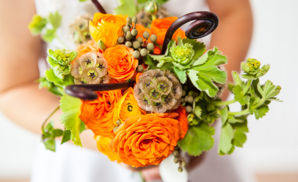 Beautiful green and orange bridal bouquet by Stem Designs in Salem, Oregon