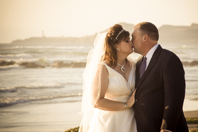 Bridal portrait of newlywed couple on the beach Newport Oregon